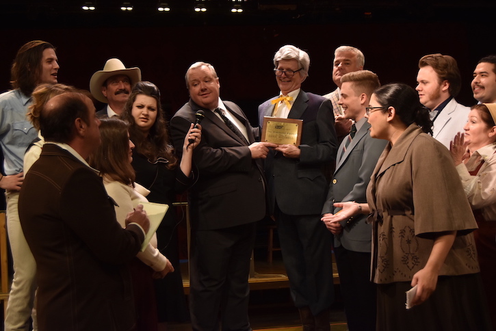 Robert Frazier (center left), presents plaque to David Bisett. Photo by Mary Rath